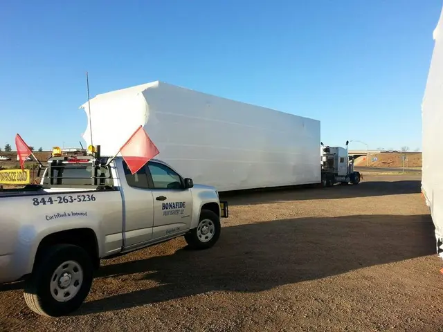 Bonafide pilot truck beside a modular building on a trailer