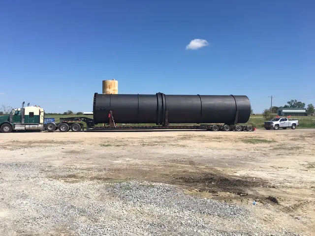 Black cylindrical tank on a trailer