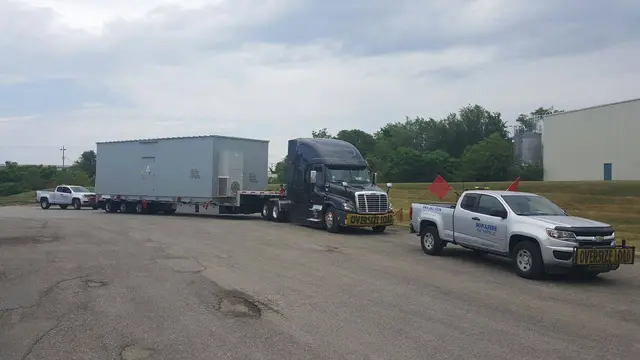 Bonafide pilot truck with a modular building load
