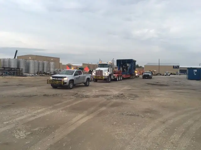 Bonafide pilot truck and a load staged in a gravel yard