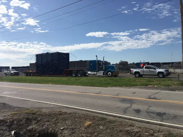Tank load on the highway with a pilot truck