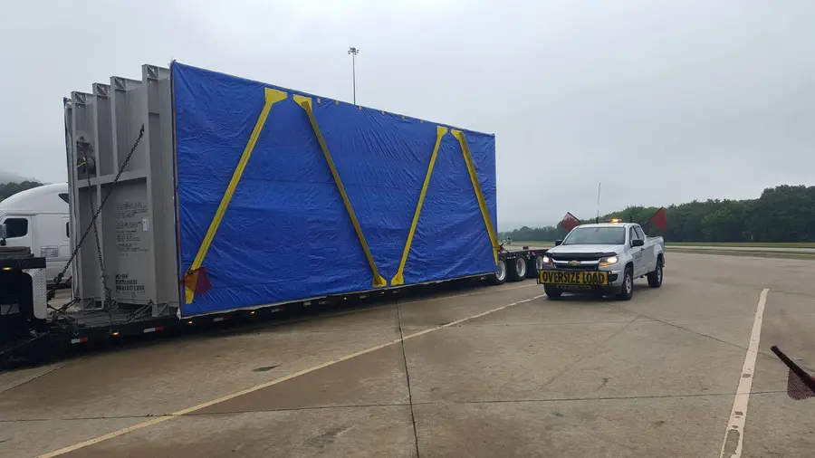 Bonafide escort with a tarped oversize load